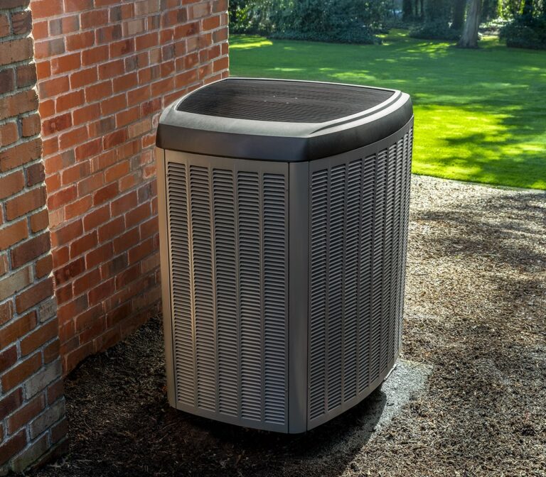 Rusk heat pump outside a brick home